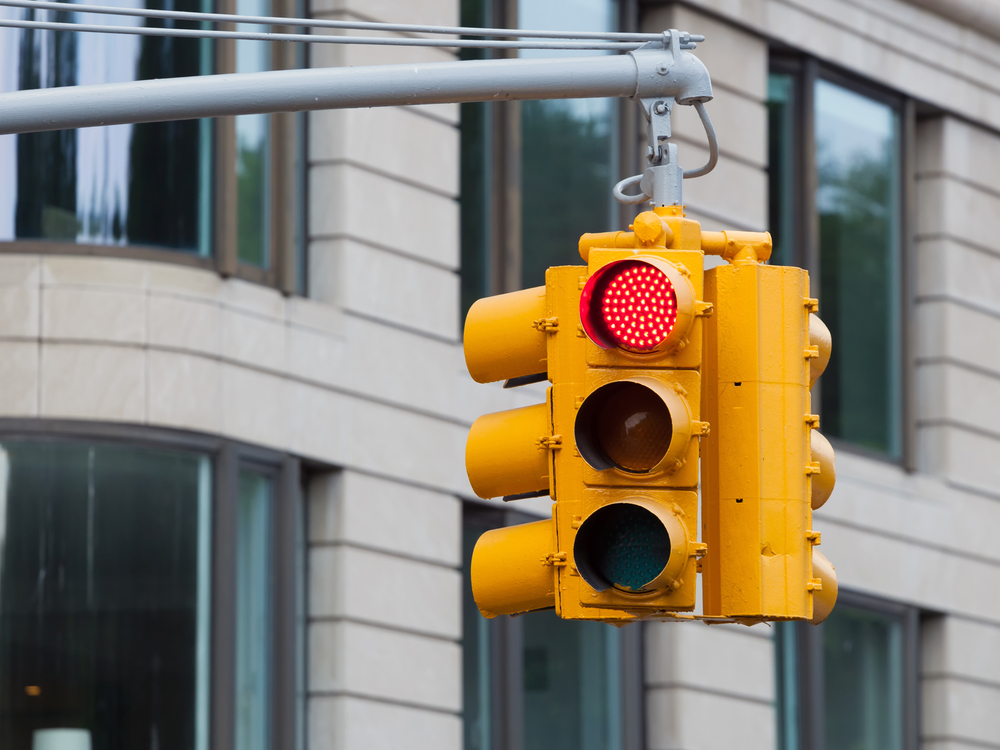 My spouse was injured in a red light collision. What should we do? Featured Image